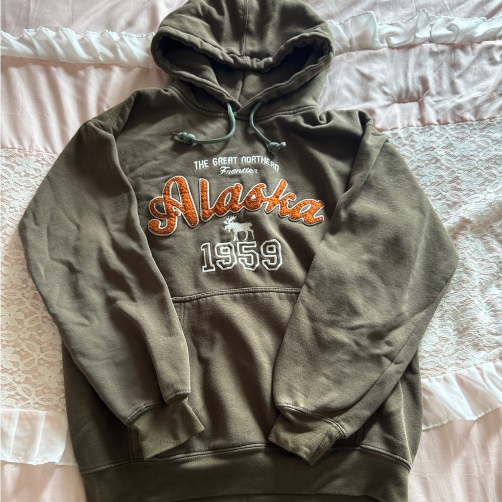 Green Pullover Sweater with Orange Graphics